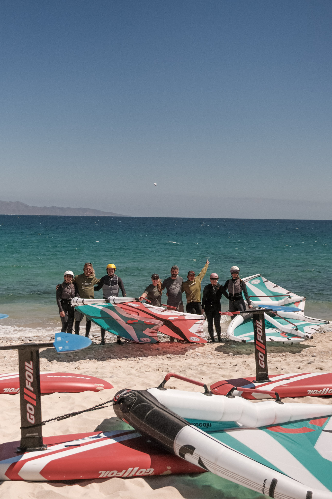 Baja Wing group with boards and wings beside the beach